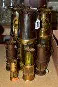 MINERS LAMPS, a collection of three standard size miners lamps and four small miners lamps, two of