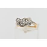 A YELLOW METAL THREE STONE DIAMOND RING, designed with three graduated, round brilliant cut