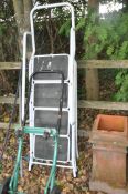 THREE STEP LADDERS AND A SACK TROLLEY including a painted steel set 170cm high