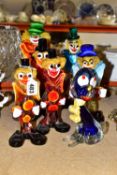 SIX MURANO STYLE GLASS CLOWNS TOGETHER WITH A DOG, comprising a Murano style blue glass dog,