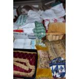 FOUR BOXES OF HOUSEHOLD LINENS, to include throws, cushions, cushion covers, tablecloths and