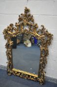 A MID TO LATE 20TH CENTURY FRENCH GILTWOOD OVERMANTEL MIRROR, with a bevelled mirror plate, 110cm