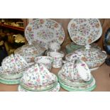 A MINTON 'HADDON HALL' PATTERN DINNER SET, comprising two covered tureens, a gravy boat with