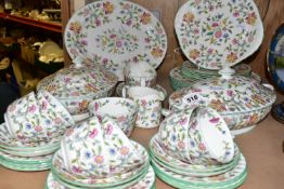 A MINTON 'HADDON HALL' PATTERN DINNER SET, comprising two covered tureens, a gravy boat with