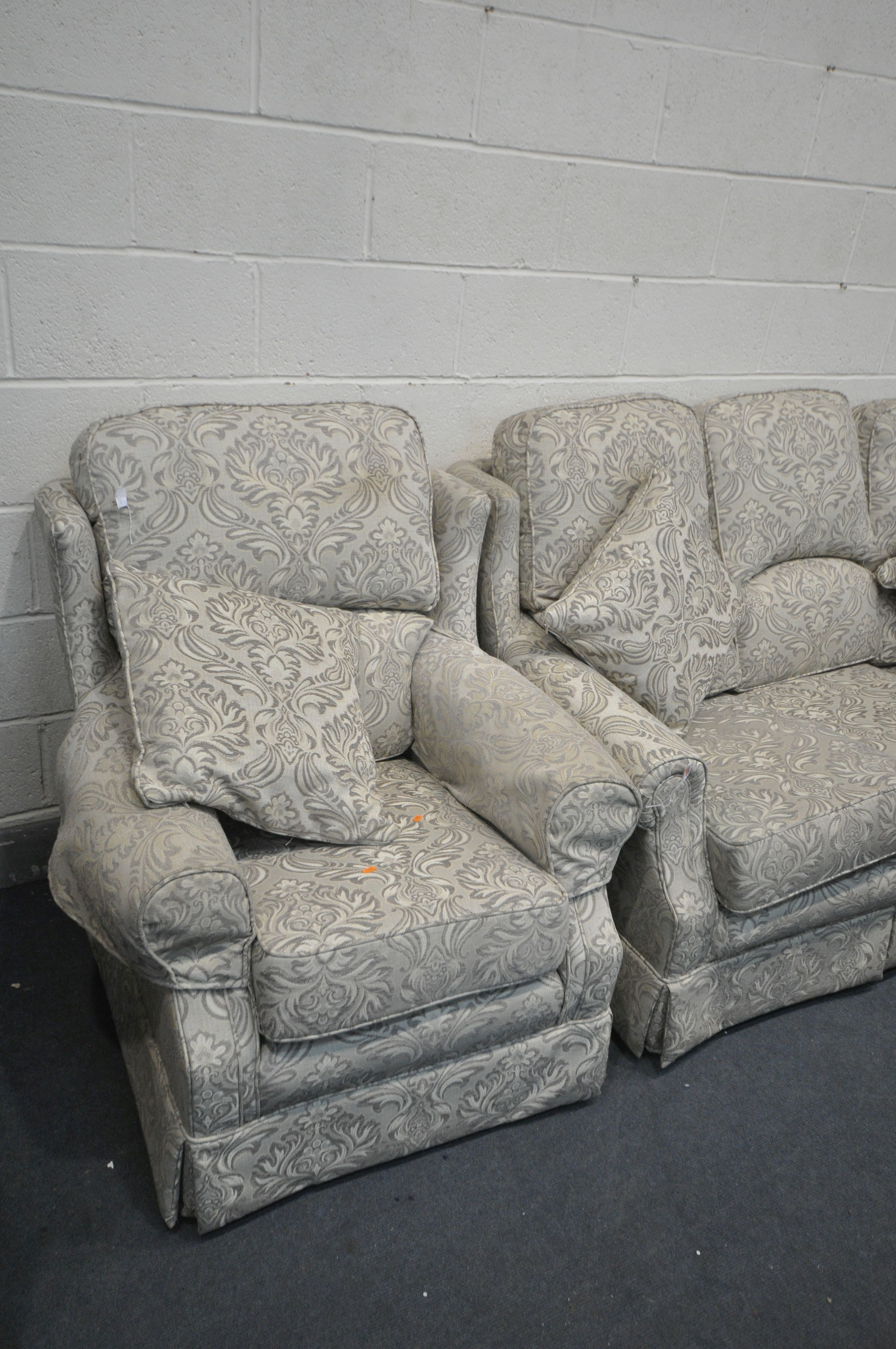 A FLORAL UPHOLSTERED THREE PIECE LOUNGE SUITE, comprising a three seater settee, and a pair of - Image 3 of 3