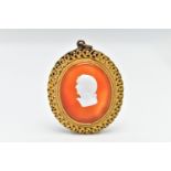 AN 18TH CENTURY CARNELIAN AND PASTE CAMEO PENDANT, an oval cut carnelian showing some curved