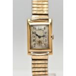 A YELLOW METAL WRISTWATCH, a hand wound movement, rectangular dial, Arabic numerals, subsidiary