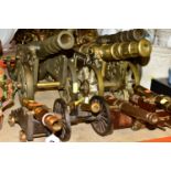 SEVEN BRASS ORNAMENTAL CANNONS, two matching cannons, length 47cm x width 15cm, one solid brass