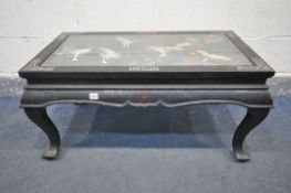 AN ORIENTAL EBONNISED AND MOTHER OF PEARL INLAY COFFEE TABLE, with a glass insert that's enclosing