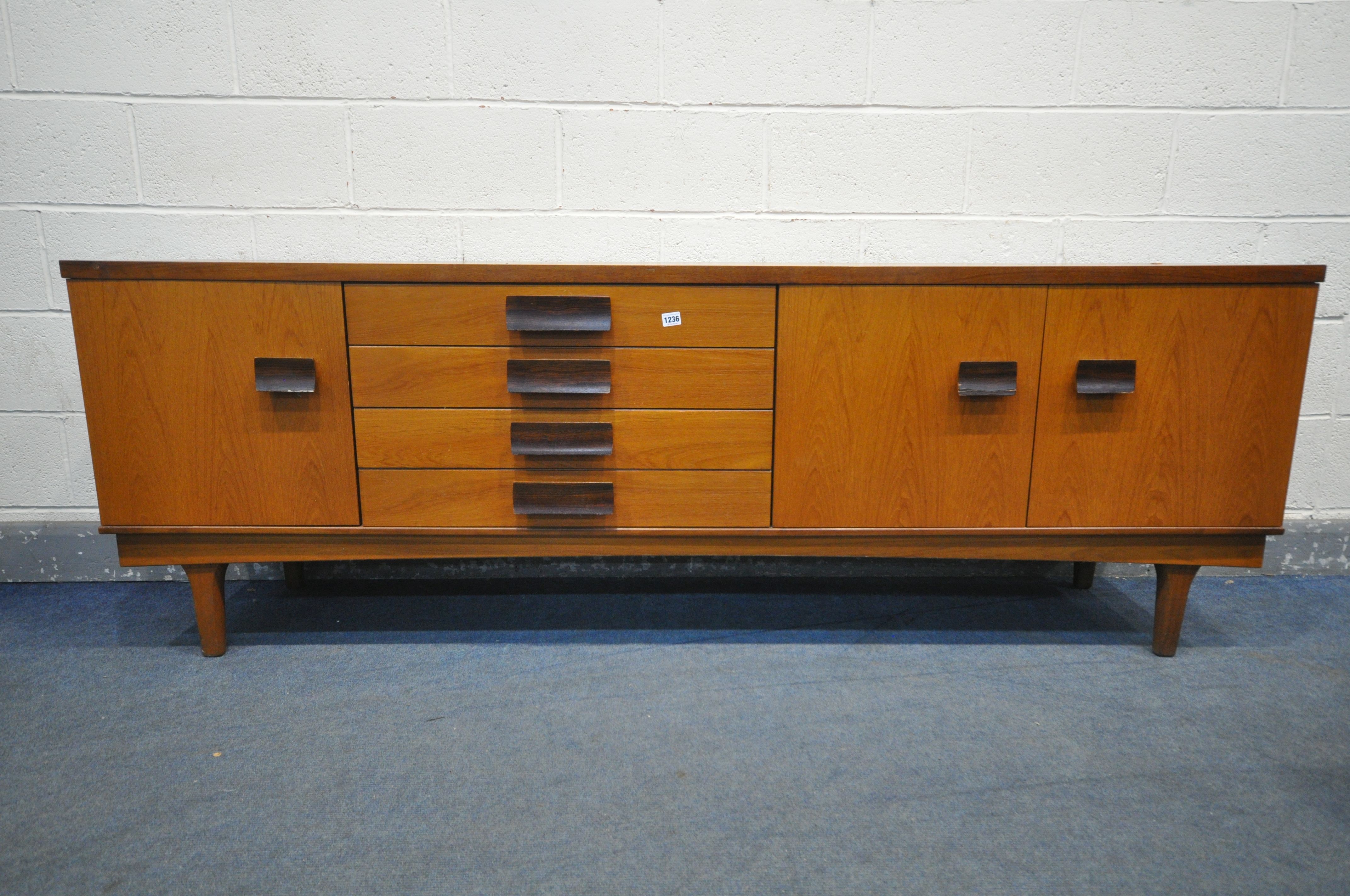 A BATH CABINET MAKERS 1960'S TEAK SIDEABOARD, with a single and double cupboard doors that a both - Image 2 of 3