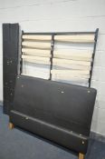 A BROWN FAUX LEATHER 4FT6 BED FRAME, with beech slats (condition:-some slat brackets either broken