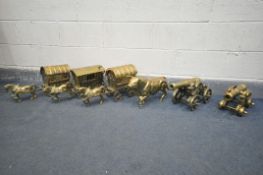 SIX VARIOUS HEAVY BRASS ITEMS, to include three brass drawn caravans, a bull statue, and two