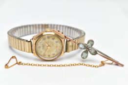 A 9CT GOLD WRISTWATCH AND ROSE METAL BAR BROOCH, a hand wound wristwatch, round dial signed 'J W