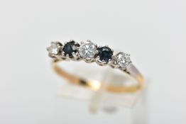 A YELLOW AND WHITE METAL DIAMOND AND SAPPHIRE FIVE STONE RING, set with three graduating round