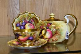 FOUR PIECES OF AYNSLEY ORCHARD GOLD, comprising a teapot, a cabinet teacup with gilt interior,