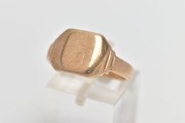 A YELLOW METAL SIGNET RING, of a square form, worn engraved initials, polished band, stamped 9ct,