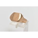 A YELLOW METAL SIGNET RING, of a square form, worn engraved initials, polished band, stamped 9ct,