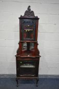 AN EARLY 20TH CENTURY STAINED MAHOGANY TWO TIER CORNER CUPBOARD, with two cupboard doors and