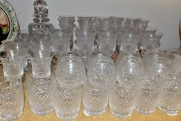 A SUITE OF GLASSWARES, fifty one pieces, moulded with vine and diamond design, comprising a square