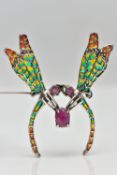 A PLIQUE A JOUR AND RUBY DRAGONFLY BROOCH, designed as two dragonflies meeting at an oval cut