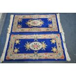 TWO BLUE AND CREAM CHINESE WOLLEN RUGS, 149cm x 79cm