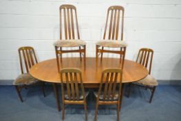 A MID-CENTURY TEAK EXTENDING DINING TABLE, with a single fold out leaf, extended length 200cm x