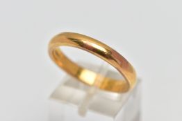 A YELLOW METAL WEDDING BAND, designed as a plain polished D shape cross section band, unmarked,