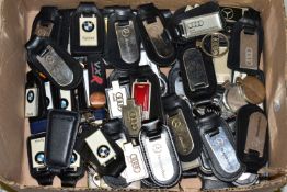 CAR AND CAR DEALERSHIP KEY RINGS, approximately eighty-five key rings from car dealerships and