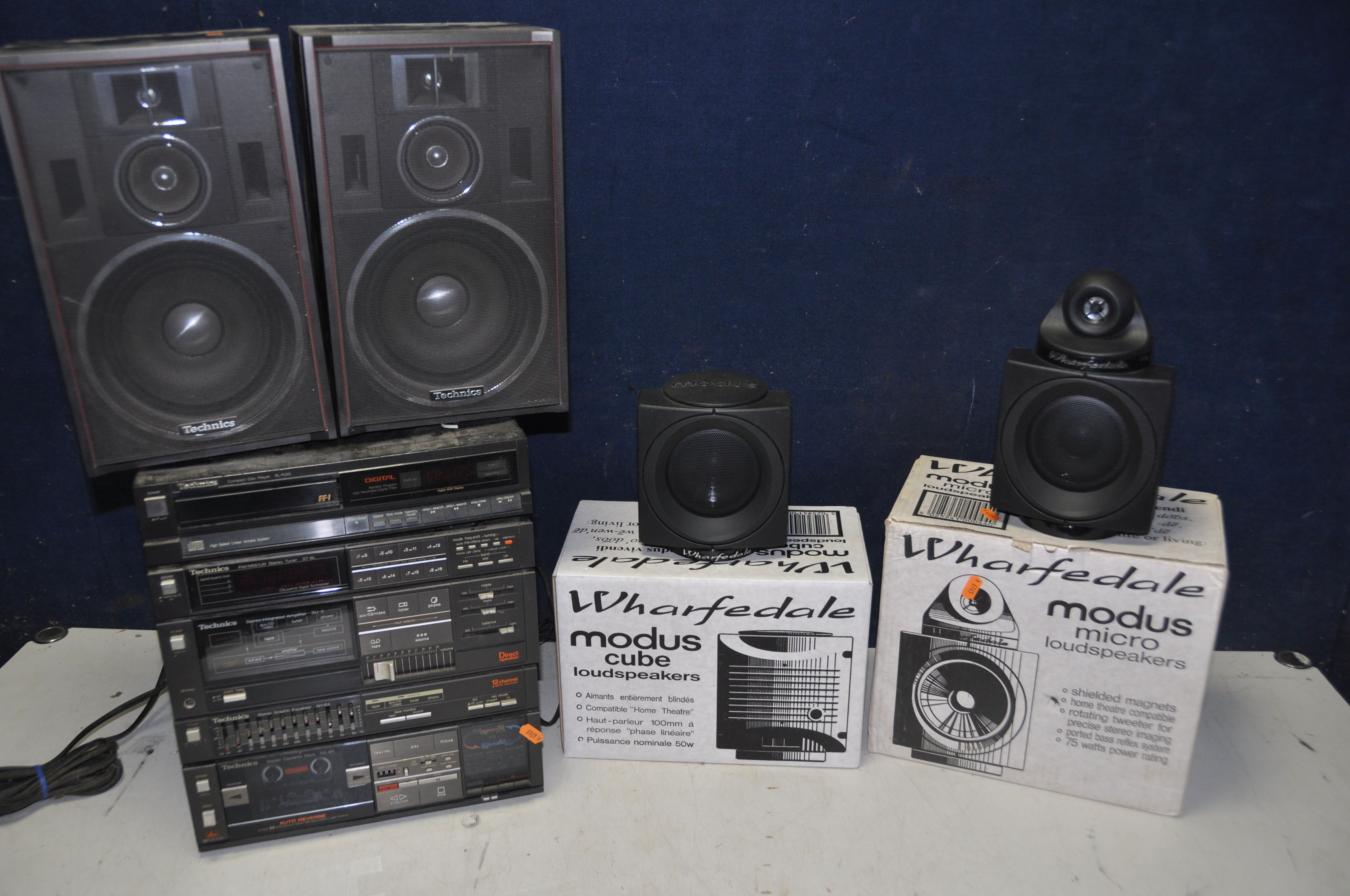 TWO BOXED PAIRS OF WHARFDALE MODUS SPEAKERS, comprising a pair of Wharfdale modus micro cube