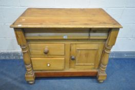 A VICTORIAN PINE SIDEBOARD/WASHSTAND, with turned pillars that's flanking a serpentine drawer front,
