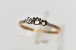AN AF YELLOW METAL DIAMOND RING, a three stone white metal setting, one single cut diamond prong set