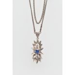 AN 18CT WHITE GOLD SAPPHIRE PENDANT, of floral design, the pendant claw set with a circular cut