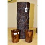 A CARVED BAMBOO BRUSH POT AND TWO OLIVE WOOD BEAKERS, the carved bamboo pot deeply carved with upper