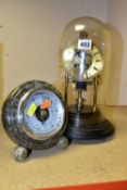 A GLASS DOMED SKELETON CLOCK TOGETHER WITH A BAROMETER, a hand crafted Cornish Serpentine SB