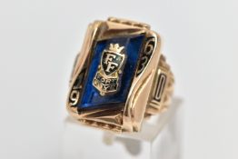 A YELLOW METAL 'HERFF JONES' CLASS RING, rectangular form set with a blue glass panel, detailed with