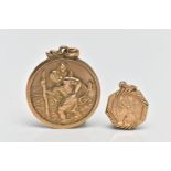 TWO 9CT GOLD ST.CHRISTOPHER PENDANTS, the first a of a circular form, personal engraving to the