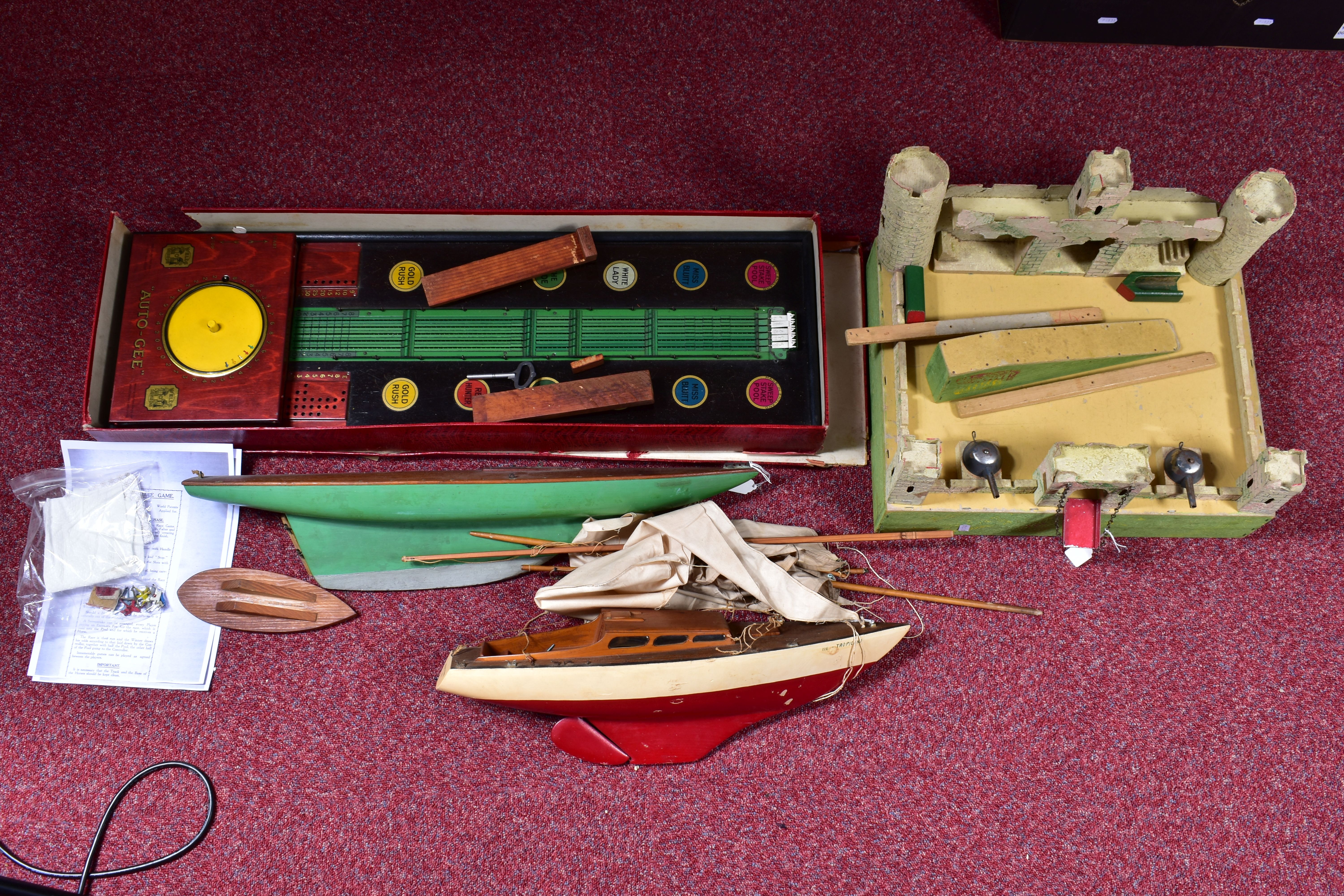 A BOXED WELLS AUTO-GEE HORSE RACING GAME, c.1927, not tested, missing one horse and two pegs, but