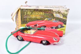 A BOXED MARX TOYS BATTERY OPERATED PLASTIC JAGUAR E TYPE, not tested, missing one windscreen