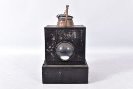 A RAILWAY HAND LAMP, reservoir, burner and wick to base, clear bullseye lens, copper chimney,