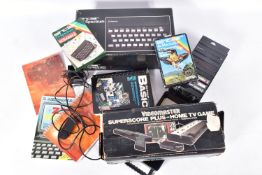 A ZX SPECTRUM 48K BOXED, VIDEOMASTER SUPERSCORE PLUS BOXED AND A QUANTITY OF GAMES, a computer,