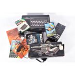 A ZX SPECTRUM 48K BOXED, VIDEOMASTER SUPERSCORE PLUS BOXED AND A QUANTITY OF GAMES, a computer,