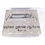A VIDEO GENIE SYSTEM BOXED, a Video Genie System in its original box, along with a small quantity of