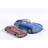 AN UNBOXED NOMURA TINPLATE FRICTION DRIVE JAGUAR E TYPE, metallic blue body, red and white interior,