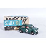 A BOXED SCALEXTRIC MINI COOPER, No.C76, green with RN8, complete with driver and in good condition