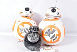 A THINKWAY STAR WARS INTERACTIVE BB-8 DROID, REMOTE AND TWO OTHERS, the first moving at time of