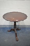 A GEORGIAN STYLE MAHOGANY TILT TOP TRIPOD TABLE, with a dish top and wavy edge, bird cage support,