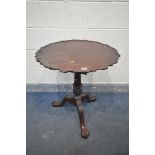 A GEORGIAN STYLE MAHOGANY TILT TOP TRIPOD TABLE, with a dish top and wavy edge, bird cage support,