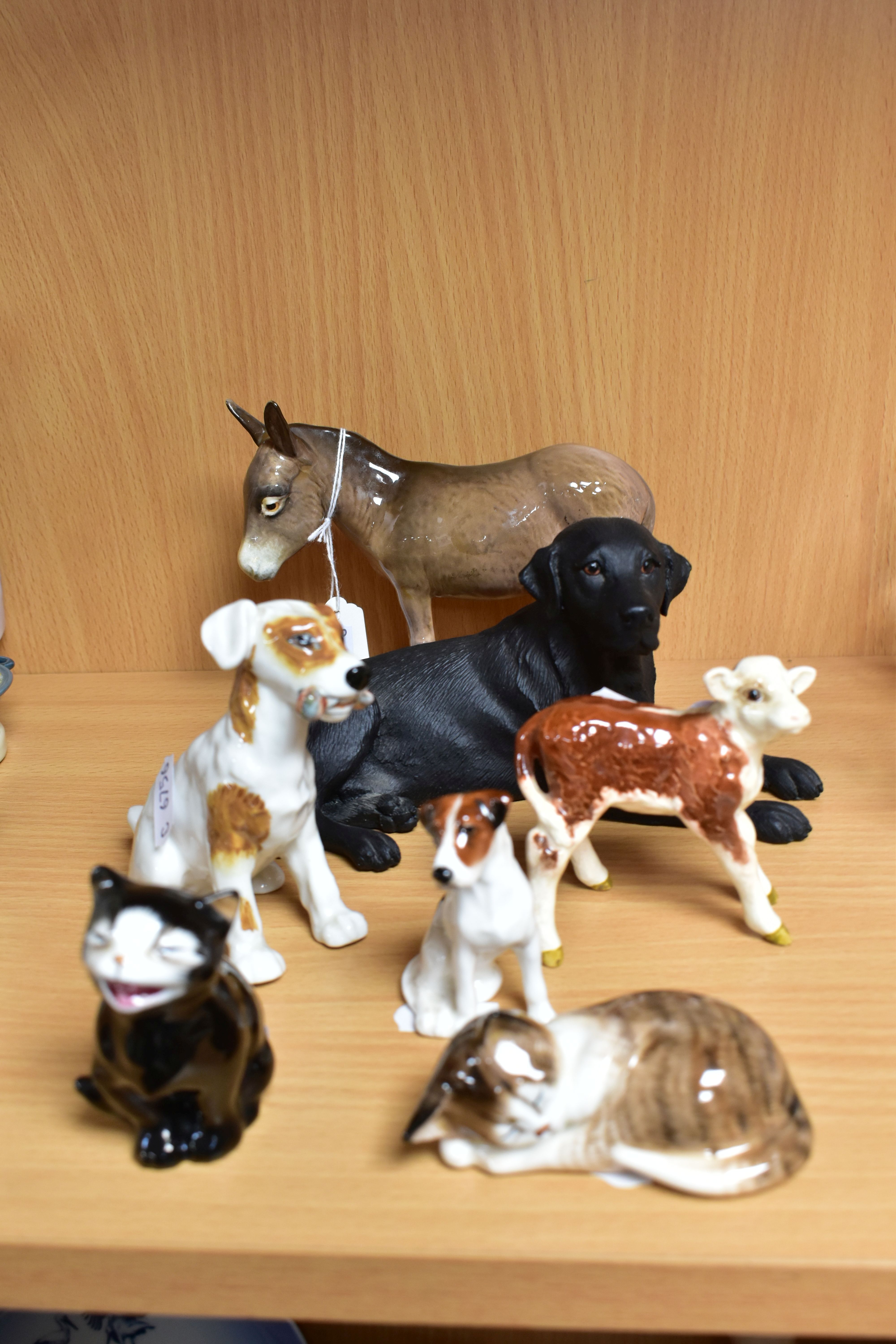 A GROUP OF SEVEN ROYAL DOULTON, BESWICK AND BORDER FINE ARTS ANIMALS, the Royal Doulton comprising