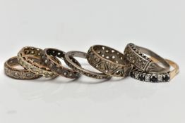 A SELECTION OF PREDOMINANTLY METAL GEM SET RINGS, to include a silver gilt sapphire and cubic