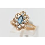 A 9CT GEM SET RING, the ring of a lozenge shape, set with a central marquise cut light blue